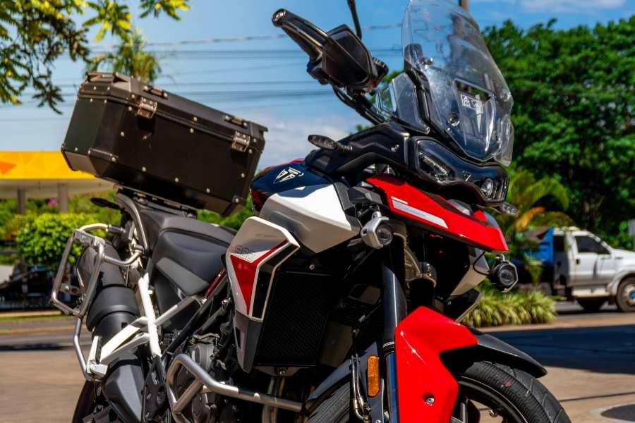 A close-up view of a modern adventure motorcycle featuring clear motorcycle screens for optimal wind protection.